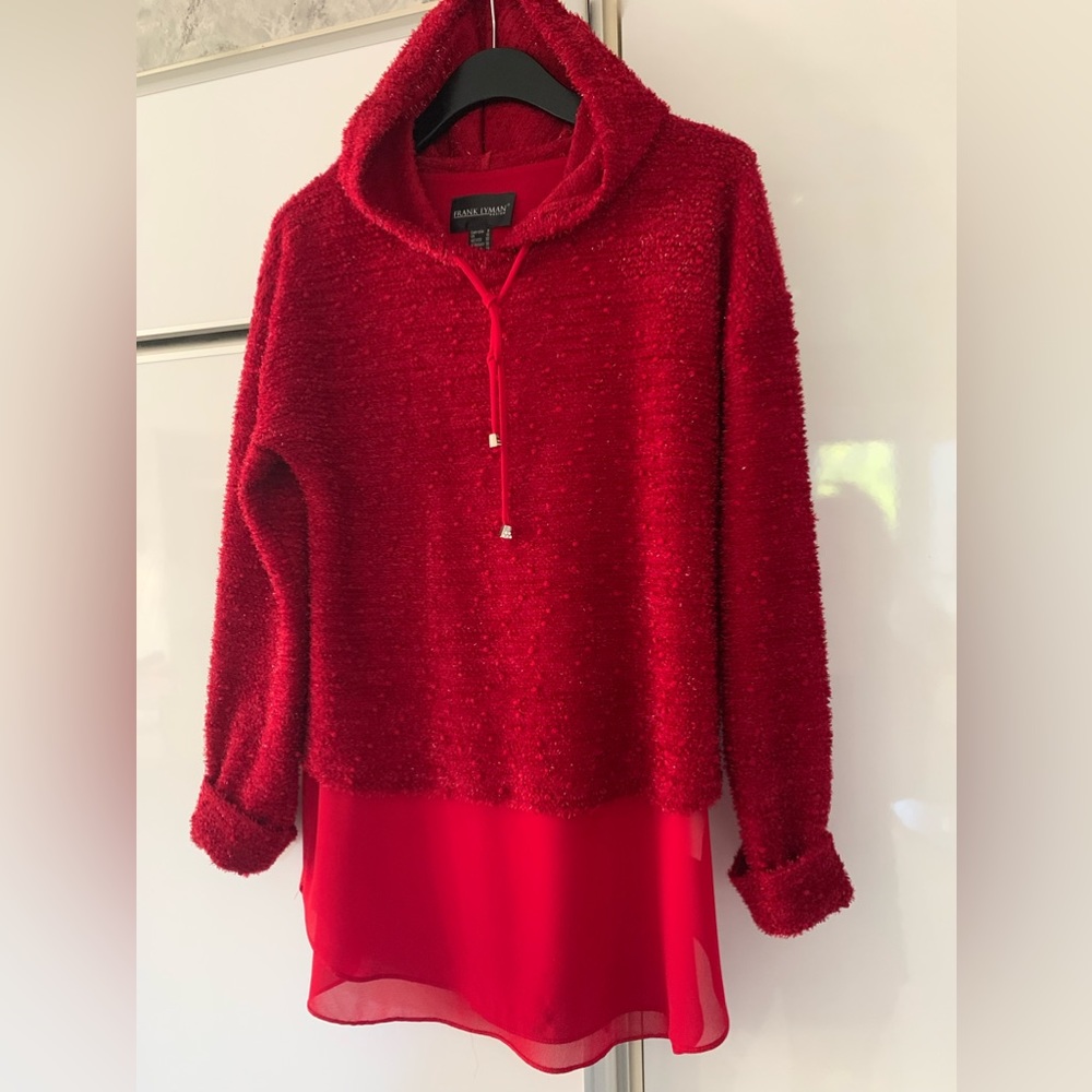 Sparkling boucle red sweater over a red sheer tank on an angle: